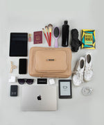 Load image into Gallery viewer, Collection of everyday items including a laptop, phone, and various personal belongings on a light gray background.
