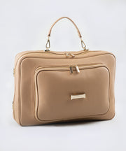 The LIAVELLA signature AVAIA bag in creme caramel featuring a wrist strap in the same colour, against a white background.