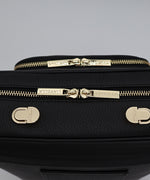 Load image into Gallery viewer, Close-up shot of the pebbled leather and gold hardware on the AVAIA bag.
