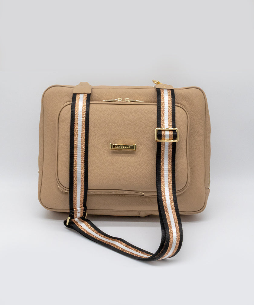 AVAIA signature bag in creme caramel, with a striped shoulder strap on a white background.