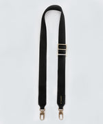 Load image into Gallery viewer, Adjustable, black fabric bag strap with gold hardware on a white background.
