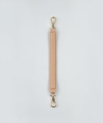 Load image into Gallery viewer, Crème caramel handheld strap on a white studio background