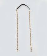 Load image into Gallery viewer, Gold chain strap with a black leather handle on a light gray background.
