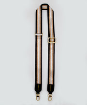 A single strap that is striped with gold accents and black trim on a white background.