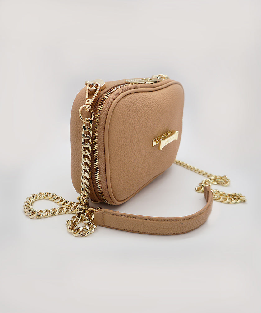 The AVAIA Petit rom the side angle, showing the clipped on gold chain strap, against a white background.