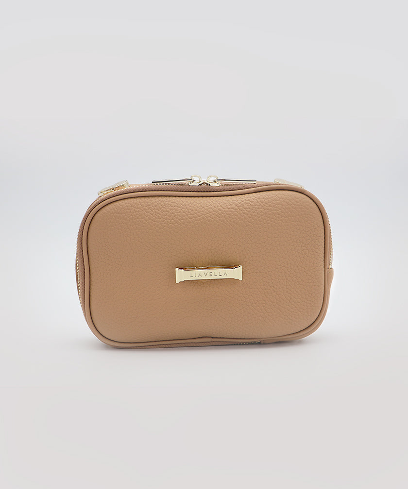 The AVAIA Petit without a strap, showing the branded "LIAVELLA" gold hardware, against a rey background.