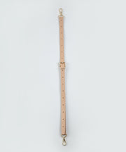 One crème caramel long leather strap.