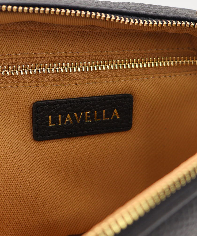 Close-up of the internal lining of a LIAVELLA bag with a zipper and visible brand name.